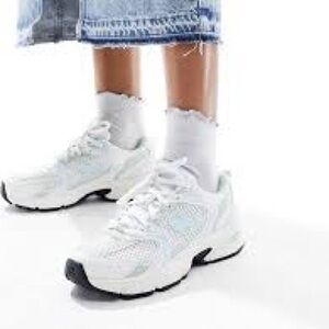 New Balance White Sneakers with Chunky Sole and Sporty Design